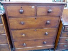 A VICTORIAN MAHOGANY CHEST OF DRAWERS.