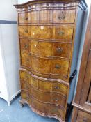 A GEORGE I STYLE WALNUT SERPENTINE FRONT CABINET ON CHEST.