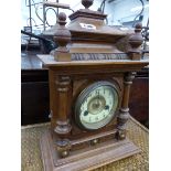 A VICTORIAN WALNUT CASED MANTLE CLOCK AND A BAMBOO SMALL TABLE.