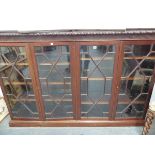 A GOOD QUALITY MAHOGANY FOUR DOOR GLAZED BOOK CASE.