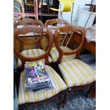 A SET OF VICTORIAN BALLOON BACK CHAIRS.