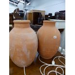 TWO SIMILAR TERRACOTTA LAMP BASES.