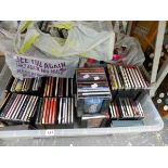 A QUANTITY OF CDS AND DVDS.