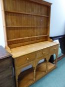 A UNUSUAL AFRICAN HARDWOOD KITCHEN DRESSER AND PLATE RACK.