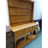 A UNUSUAL AFRICAN HARDWOOD KITCHEN DRESSER AND PLATE RACK.