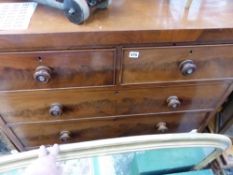 A VICTORIAN MAHOGANY CHEST OF DRAWERS.