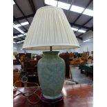 A MODERN CHINESE STYLE GREEN GLAZED LAMP