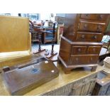 AN ANTIQUE MAHOGANY WRITING BOX, AND A MODERN MINIATURE CHEST OF DRAWERS.