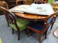 A VICTORIAN MAHOGANY BREAKFAST TABLE AND SIX VARIOUS VICTORIAN DINING CHAIRS.