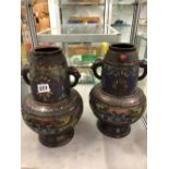 A PAIR OF ANTIQUE CLOISONNE BRONZED VASES WITH STYLISED HANDLES.