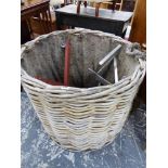 A VERY LARGE WICKER LOG BASKET.