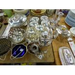 A QUANTITY OF SILVER PLATED WARES, INC. COCKTAIL SHAKER, WINE CARRIER, CANDLE STICKS ETC.