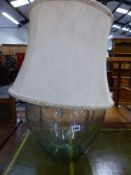 A LARGE BOTTLE LAMP.