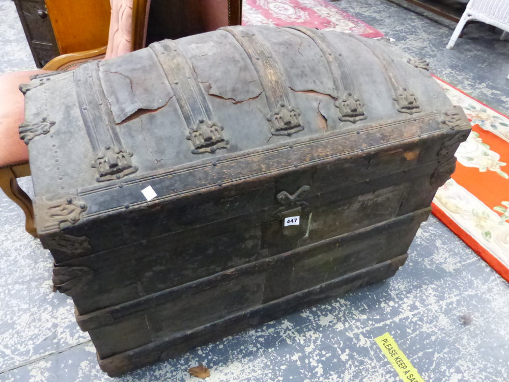 A LARGE DOME TOP TRUNK.