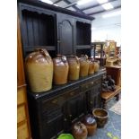 A LATE VICTORIAN OAK DRESSER WITH PLATE RACK OVER.