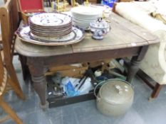 A LATE VICTORIAN OAK DINING TABLE.