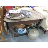 A LATE VICTORIAN OAK DINING TABLE.