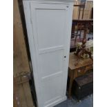 A SMALL PAINTED HALL CUPBOARD.