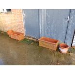 A PAIR OF RECTANGULAR CLASSICAL STYLE TERRACOTTA PLANTERS AND OTHERS.