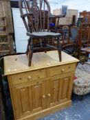 A CHILD'S WINDSOR ARMCHAIR AND A MODERN PINE SIDE CABINET.