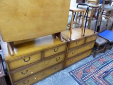 TWO MODERN CAMPAIGN STYLE CHEST OF DRAWERS, A DROP LEAF TABLE AND TWO STOOLS.