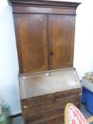 AN 18th C. OAK BUREAU BOOKCASE.