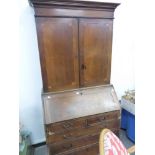 AN 18th C. OAK BUREAU BOOKCASE.