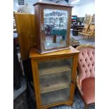 A PAIR OF MODERN BUTTON BACK NURSING CHAIRS, A GLAZED SIDE CABINET AND A MIRROR DOOR WALL CABINET.