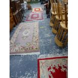 FOUR VARIOUS CHINESE WOOL RUGS.