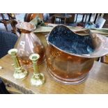 A COPPER GALLON JUG, A COAL SCUTTLE AND A PAIR OF CANDLE STICKS.