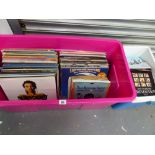 A LARGE QUANTITY OF RECORD ALBUMS AND SINGLES.