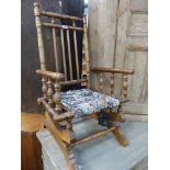 A VINTAGE CHILD'S ROCKING CHAIR AND A BEDROOM CHAIR.