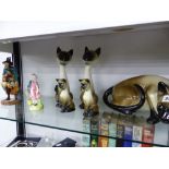 THREE ROYAL DOULTON FIGURINES AND FIVE SIAMESE CAT FIGURES.