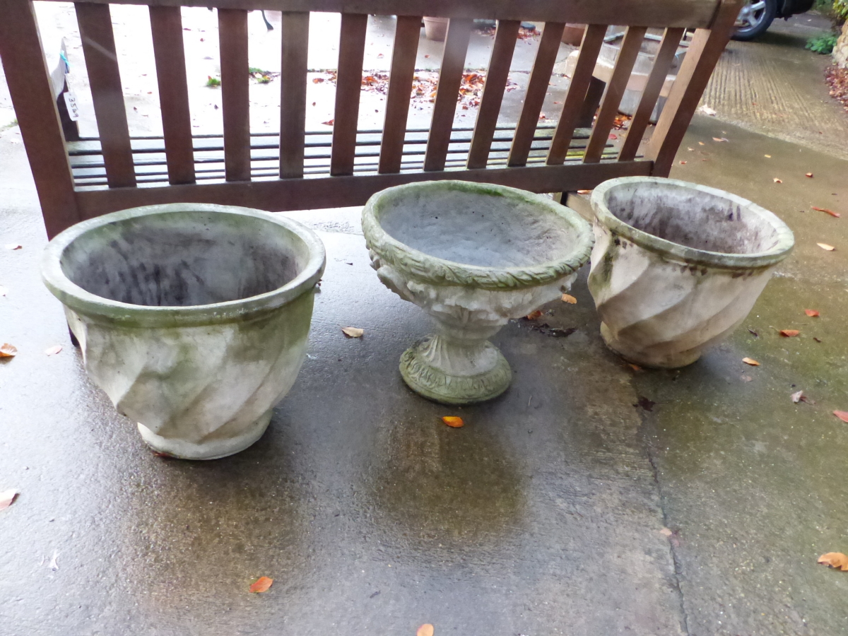 A PAIR OF PLANTERS AND A SIMILAR URN ON STAND.