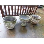 A PAIR OF PLANTERS AND A SIMILAR URN ON STAND.