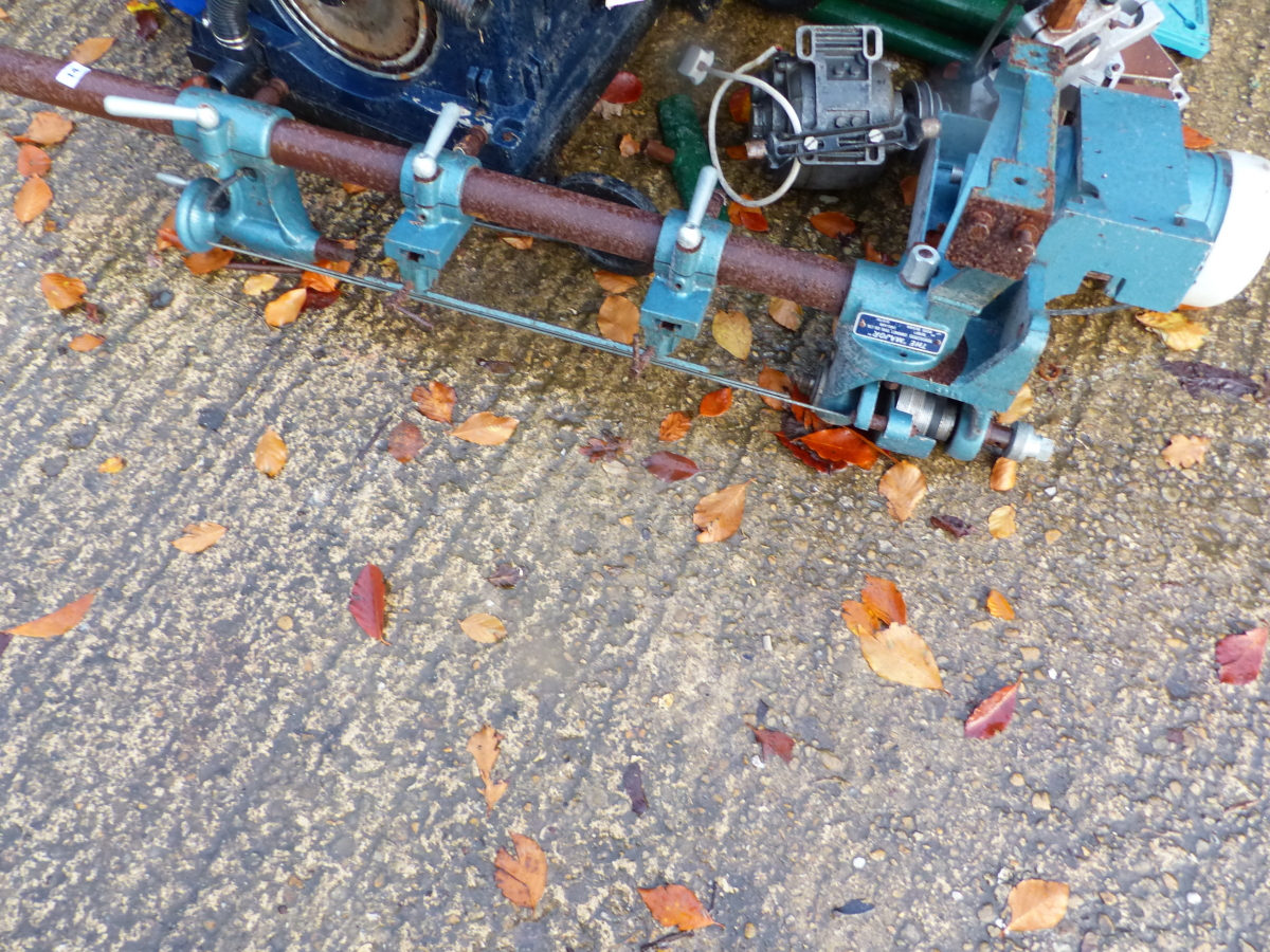 A LARGE WOOD WORKING LATHE.