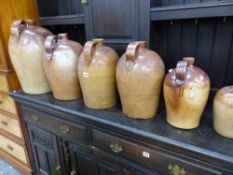 EIGHT VARIOUS POTTERY FLAGONS AND TWO PLANTERS.