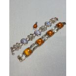 A GERMAN CONTINENTAL SILVER AND AMBER LINKED BRACELET STAMPED 835 TOGETHER WITH A PAINTED PANEL