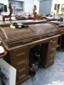 A TAMBOUR TOP WRITING DESK.