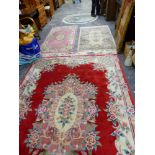 FOUR VARIOUS CHINESE WOOL RUGS.