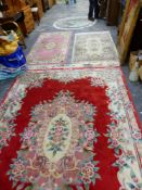 FOUR VARIOUS CHINESE WOOL RUGS.