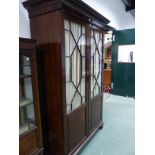 AN ANTIQUE ASTRAGAL GLAZED SHELVED CABINET.