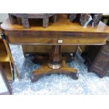 AN EARLY VICTORIAN MAHOGANY FOLD OVER CARD TABLE ON PLATFORM BASE.