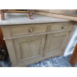 AN ANTIQUE PINE SIDE CABINET WITH TWO DRAWERS.