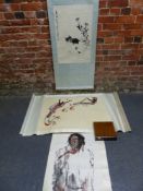 THREE CHINESE SCROLLS, ONE PRINTED IN BLACK WITH A CAT CROUCHING BY FLOWERS. 67 x 43cms. THE