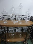 FOUR POMACK CLEAR GLASS STORAGE VESSELS AND COVERS, THE TALLEST. H 63cms. TWO VARIOUS COVERS, TWO