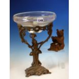 A BLACK FOREST BEAR SEATED OVER A BRASS TUB. H 12cms. TOGETHER WITH A GLASS TAZZA SUPPORTED BY A