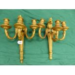 A PAIR OF GILT BRONZE THREE BRANCH WALL LIGHTS, THE NOZZLES CAST WITH FOLIAGE AND THE BACK PLATES
