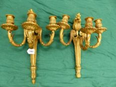 A PAIR OF GILT BRONZE THREE BRANCH WALL LIGHTS, THE NOZZLES CAST WITH FOLIAGE AND THE BACK PLATES