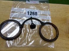 A RARE EARLY PAIR OF HORN RIMMED FOLDING SPECTACLES